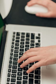 Close-Up Shot of Human Hands Placed Over Laptop.