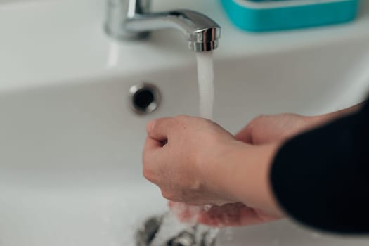 The Girl Washes Her Hands to Avoid Infection With the Virus COVID-19.