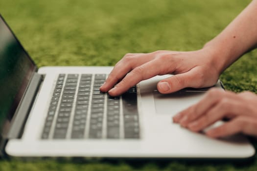 Close-Up Shot of Human Hands Placed Over Laptop.