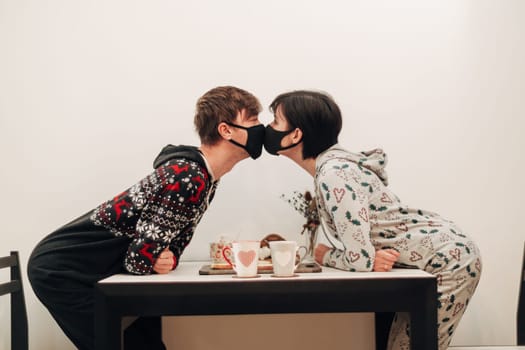 Girl and Guy Kissing in Masks on Quarantine COVID-19.