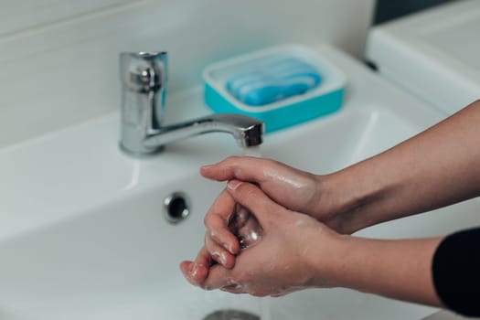 The Girl Washes Her Hands to Avoid Infection With the Virus COVID-19.