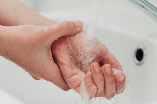 The Girl Washes Her Hands to Avoid Infection With the Virus COVID-19.