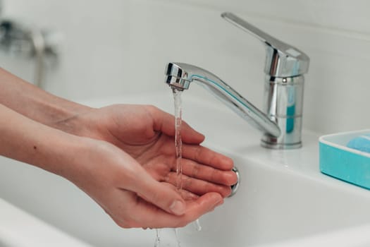 The Girl Washes Her Hands to Avoid Infection With the Virus COVID-19.