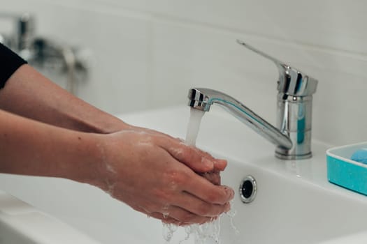 The Girl Washes Her Hands to Avoid Infection With the Virus COVID-19.