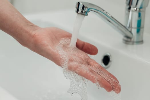 The Girl Washes Her Hands to Avoid Infection With the Virus COVID-19.