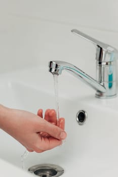 The Girl Washes Her Hands to Avoid Infection With the Virus COVID-19.