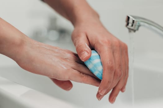The Girl Washes Her Hands to Avoid Infection With the Virus COVID-19.