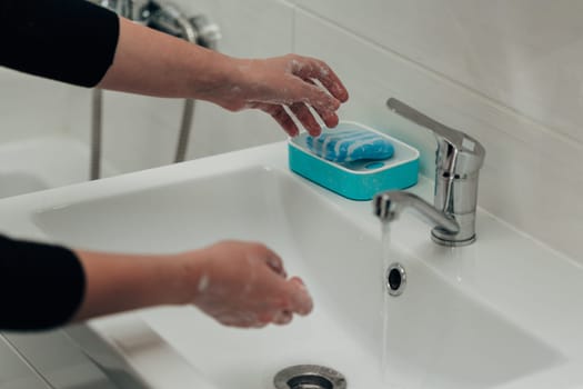 The Girl Washes Her Hands to Avoid Infection With the Virus COVID-19.