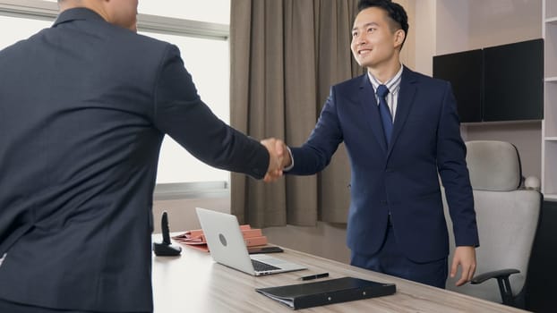 Happy young businessman and businesswoman report explaining project job offer presentation to manager or team leader in office room, businesspeople greeting handshaking with vacancy candidature