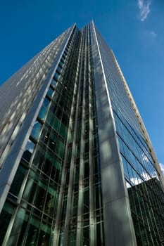 London, United Kingdom - October 10, 2006: Glass and steel offices ("More London Estates"" designed by Foster and Partners) with clear sky in background. Example of modern architecture in UK capital"