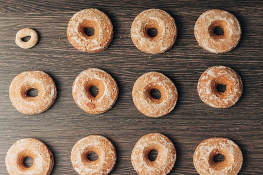 Beautiful Many Bagels and Gingerbreads Lie on a Brown Background