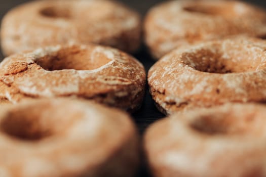 Beautiful Many Bagels and Gingerbreads Lie on a Brown Background