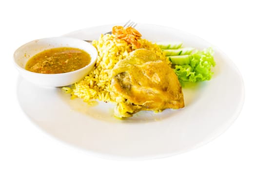 Plate of delicious chicken biryani  in white plate Thai style