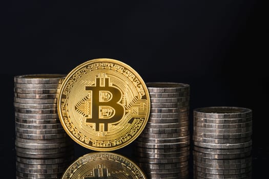Bitcoin cryptocurrency digital bit coin currency concept ,Golden coins with bitcoin and cions on black background