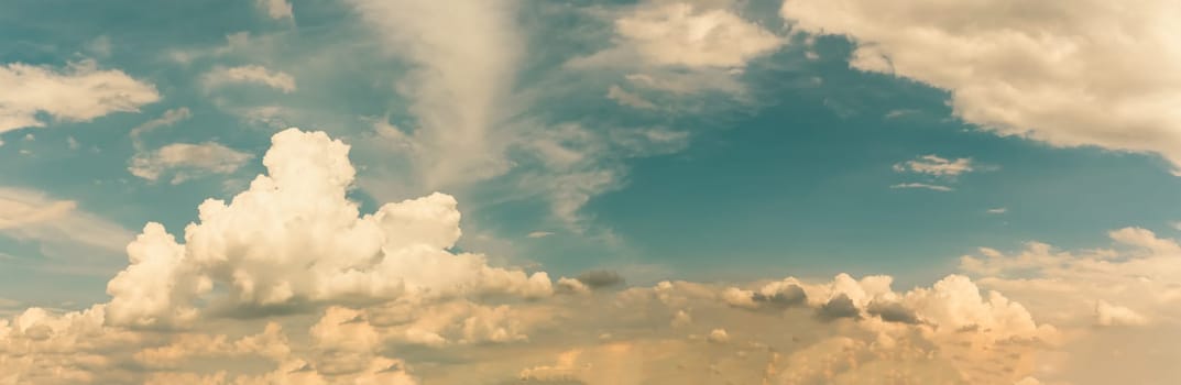 Summer cloud sky panorama with fleece clouds, Vibrant color panoramic sky with cloud on a sunny day