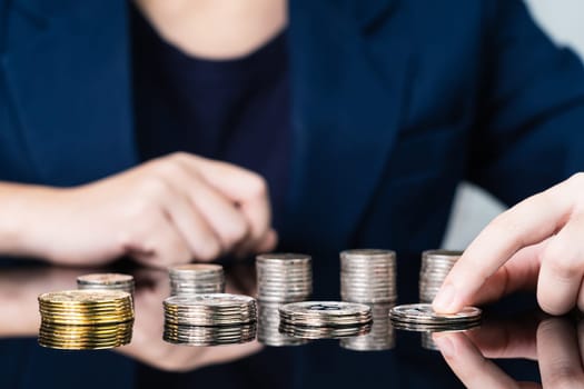 Close up of business woman holding some pieces of golden Bitcoin token , Bitcoin is one of the popular cryptocurrency
