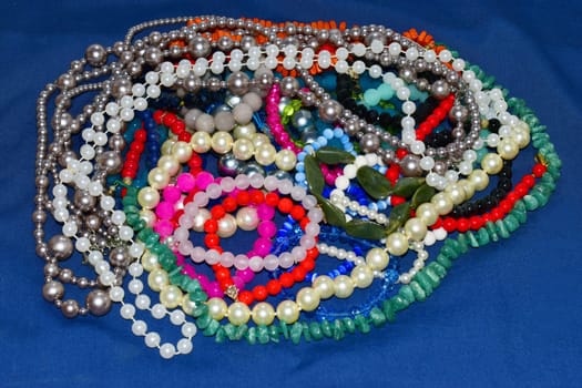 colorful womens beads on a blue background