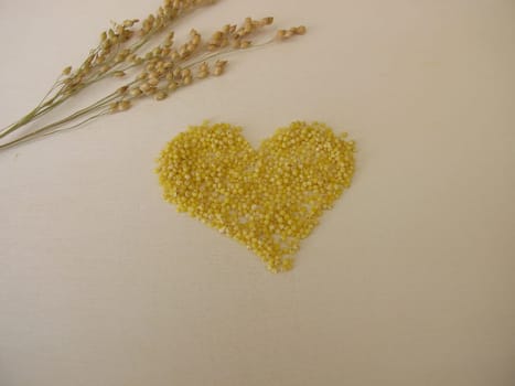 Small-seeded millet on wooden board