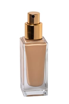 Cosmetic foundation isolated. Close-up of an closed glass bottle with liquid skin foundation isolated on a white background. Clipping path. Makeup concept of moisturiser and toner creme. Macro.