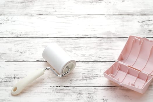 sticky roller cleaning, housework and housekeeping concept