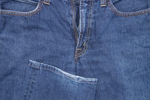Jeans pants front with pockets and fly, jeans background, denim pattern