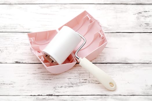 sticky roller cleaning, housework and housekeeping concept