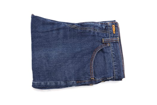 Folded blue jeans isolted on white background, denim folded on white background