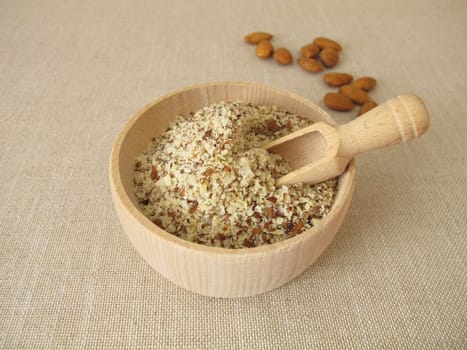 Unpeeled ground almonds in a wooden bowl