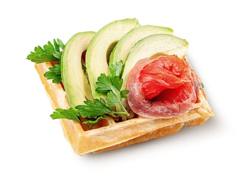French waffle with avocado and salmon isolated on white background