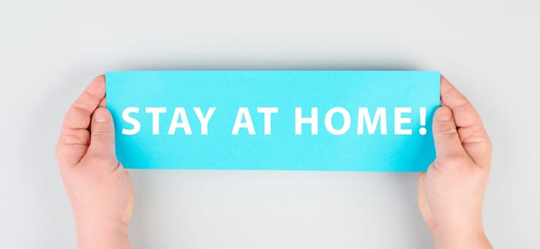 The words stay at home are standing on a paper, isolation due to covid-19 pandemic, quarantine