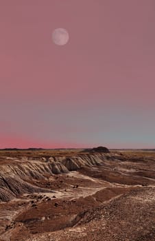 Moon rise above the ancient petrified forest in Arizona