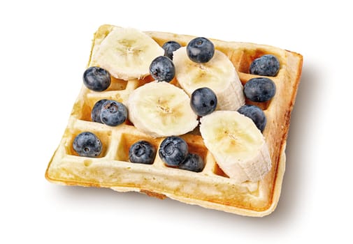 French waffles with blueberries and bananas top wiev isolated on white background