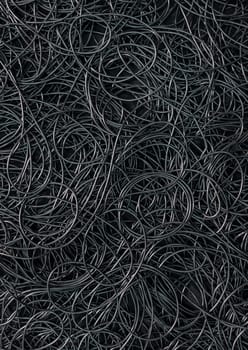 Background covered with a pile of electric cords filling the entire frame