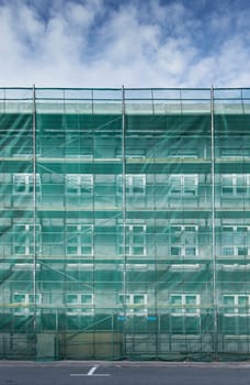 Scaffolding covering a house in construction