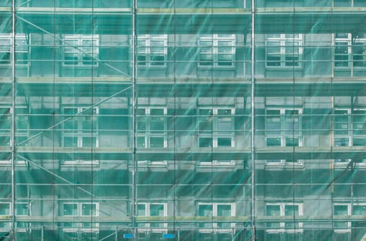 Scaffolding covering a house during building stage