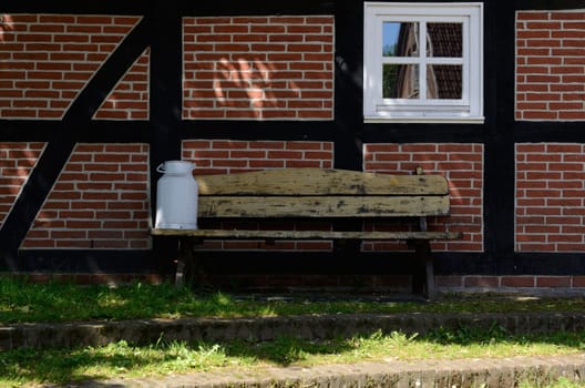 Milk can on a bench