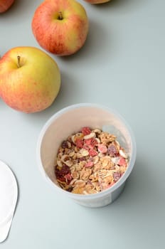Muesli to go on a bright turquoise kitchen table
