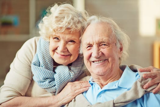 Happy seniors looking at camera