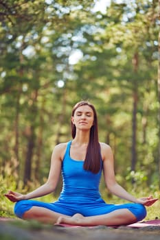 Young female in sportswear getting natural energy