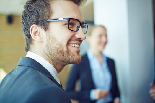 Smiling businessman in eyeglasses