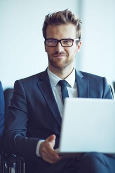 Elegant employee with laptop during meeting