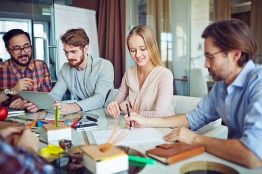 Business group planning work in office