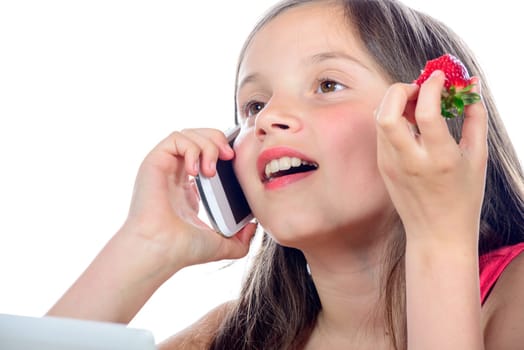 a little girl with a mobile phone on white background
