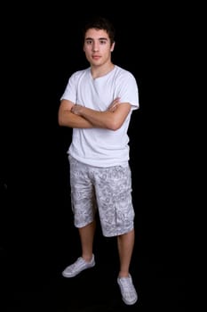 young casual man full length, on a black background