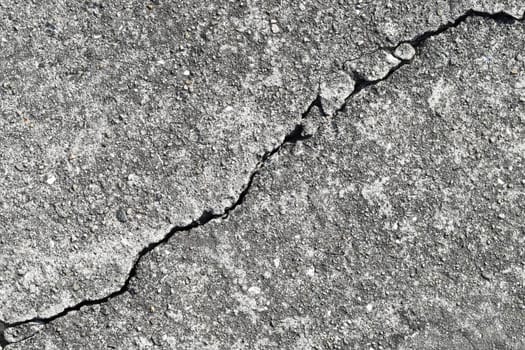 Gray cracked building wall texture for background, copy space