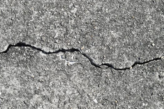Gray cracked building wall texture for background, copy space