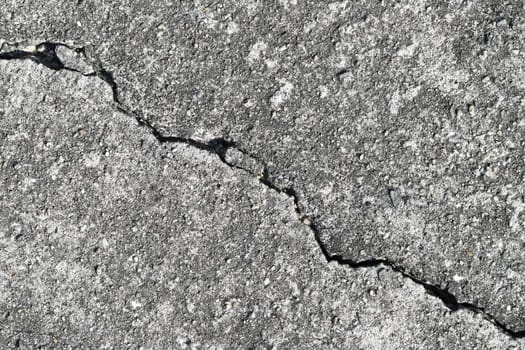 Gray cracked building wall texture for background, copy space
