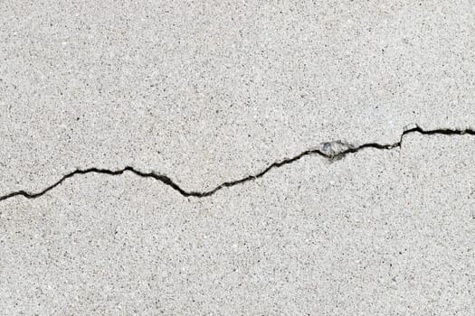 Gray cracked building wall texture for background, copy space
