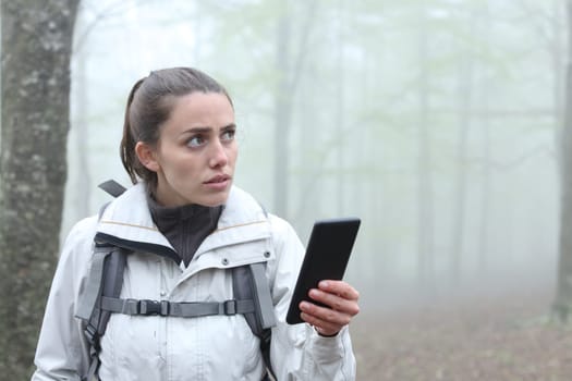 Lost trekker using phone to locate in a forest