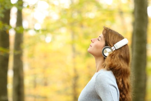 Female breathing fresh air wearing headphones